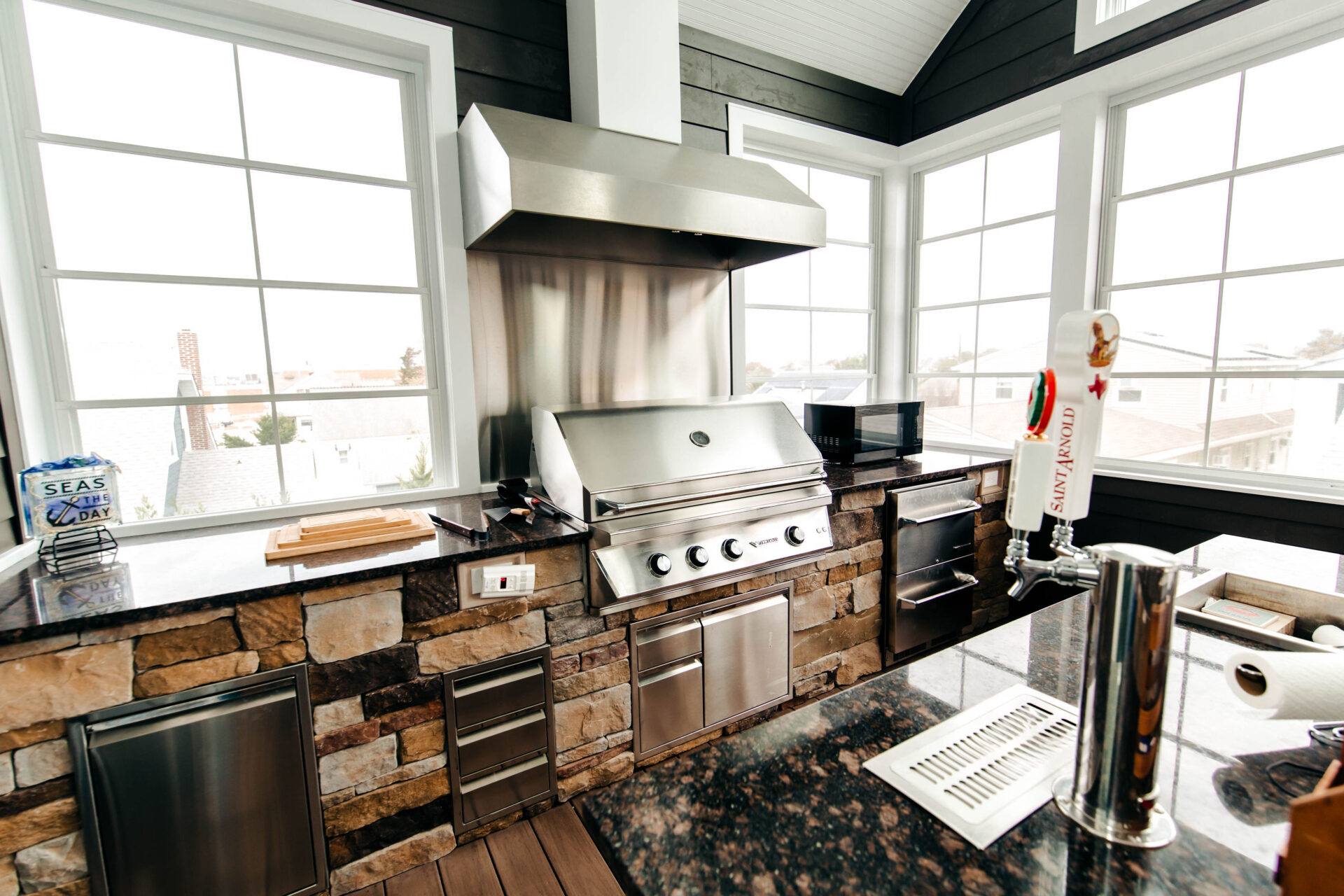 a kitchen area with unique appliances and marble countertop