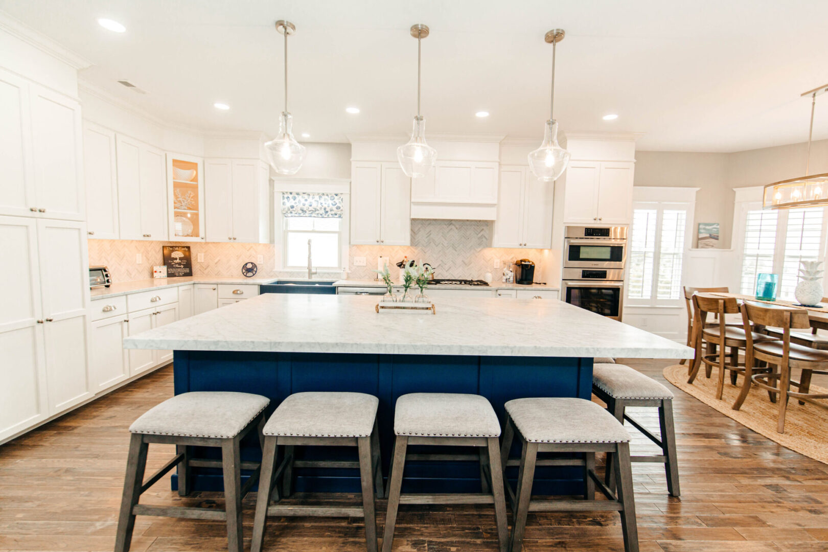 a center kitchen island and stools around it