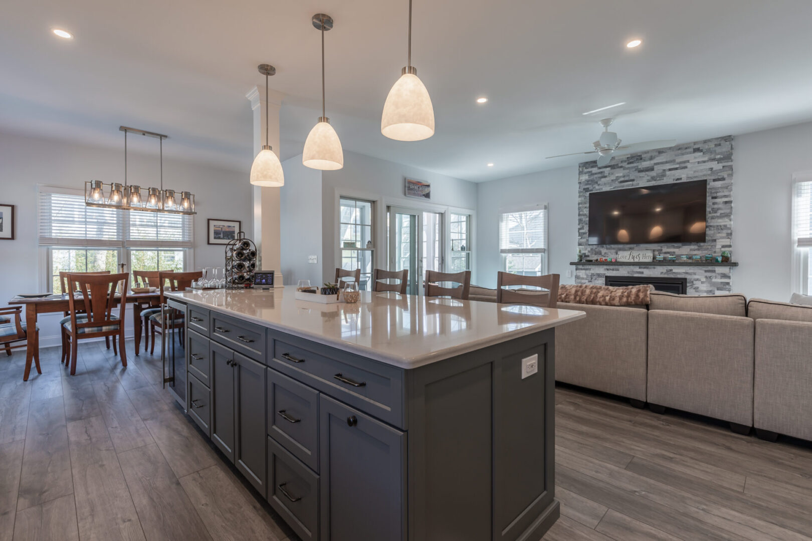 a marble island with grey cabinets